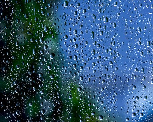 Glass of water near a window